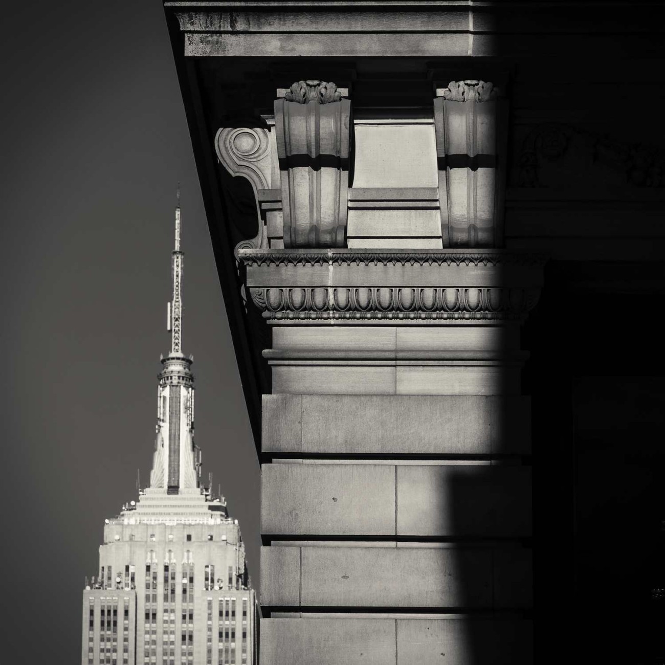 Empire State Building tower and cornice with shadow, New York, 2